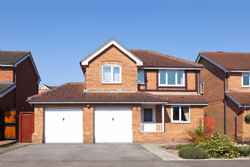 Detached house with a double garage.